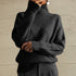 	Look con jersey geometrico cuello alto y vaqueros - Esencia Mujer
